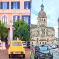 An old post office and a church in Beaune, France 